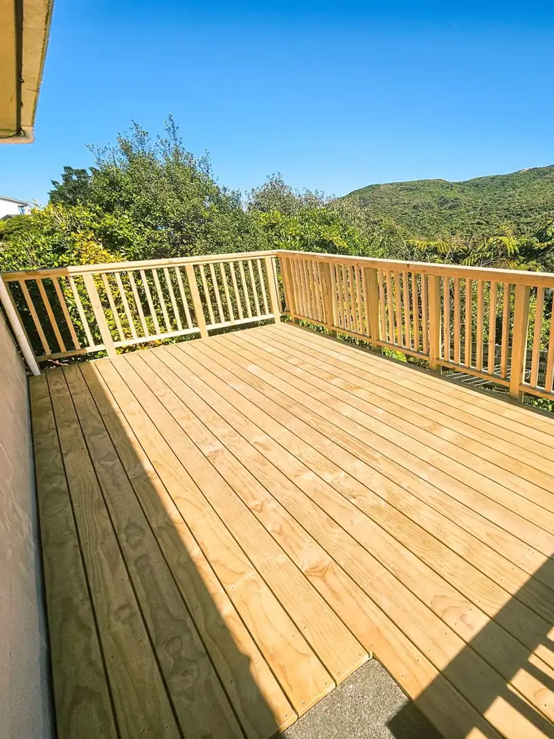 Elevated timber deck and its edge overlooking a sloping site