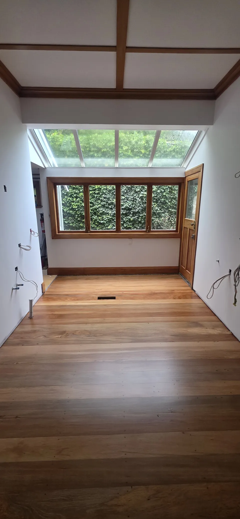 Timber floor leading towards the bay window